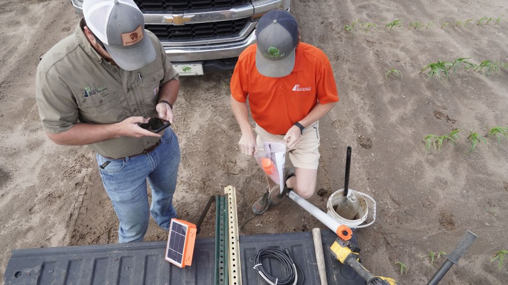 agronomists-installing-moisture-sensors