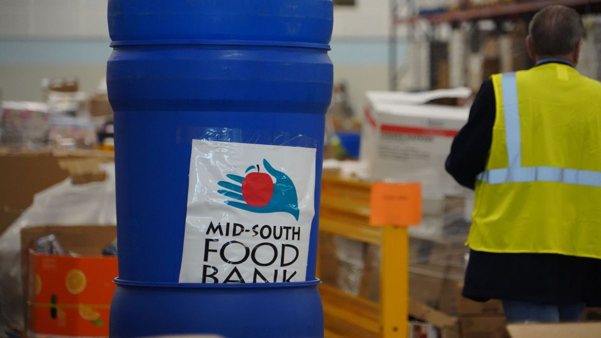 Blue Cynlinder Container that reads 'Mid-South Food Bank'